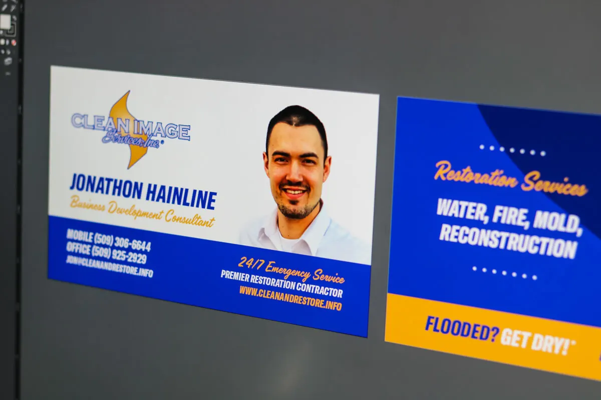 Image of a business card draft in Illustrator on a computer monitor